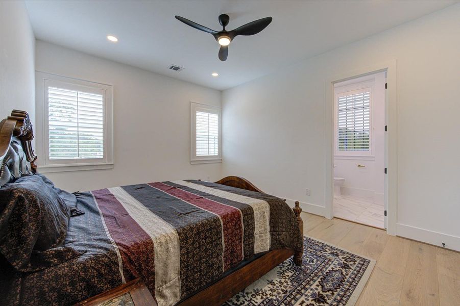Bedroom #2 on 2nd floor. Every bedroom has dimmer switch, ceiling fan, hardwood floor and window shutters.