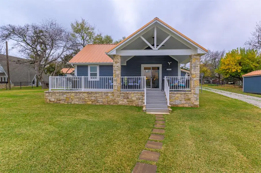 Front exterior of a new home in , Graford, TX, highlighting curb appeal (Image 1).