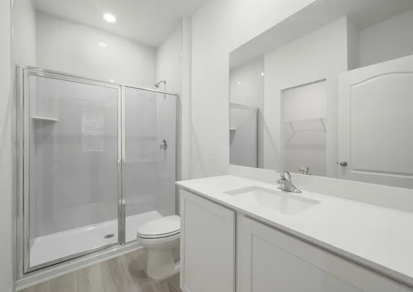 The master bathroom has a large walk in shower