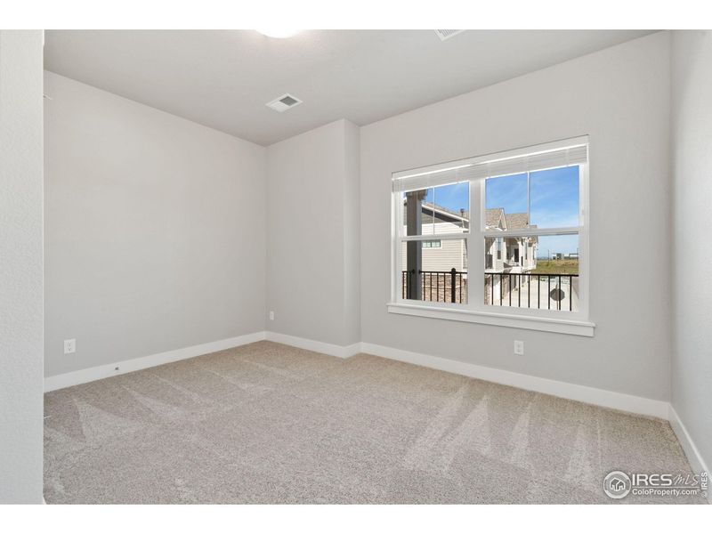Spacious, unfurnished interior of a new home in The Lakes at Centerra - North Shore Flats, Loveland (Image 11).