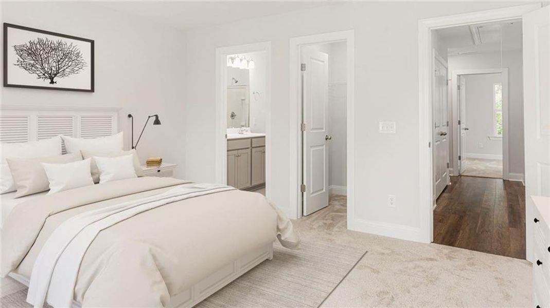 Bedroom featuring ensuite bathroom and light hardwood / wood-style flooring