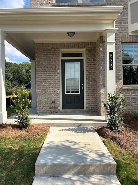 Exterior details and patio area of a home in Towns at Enclave, Lawrenceville (Image 2). Exterior details and patio area of a home in Towns at Enclave, Lawrenceville (Image 2).