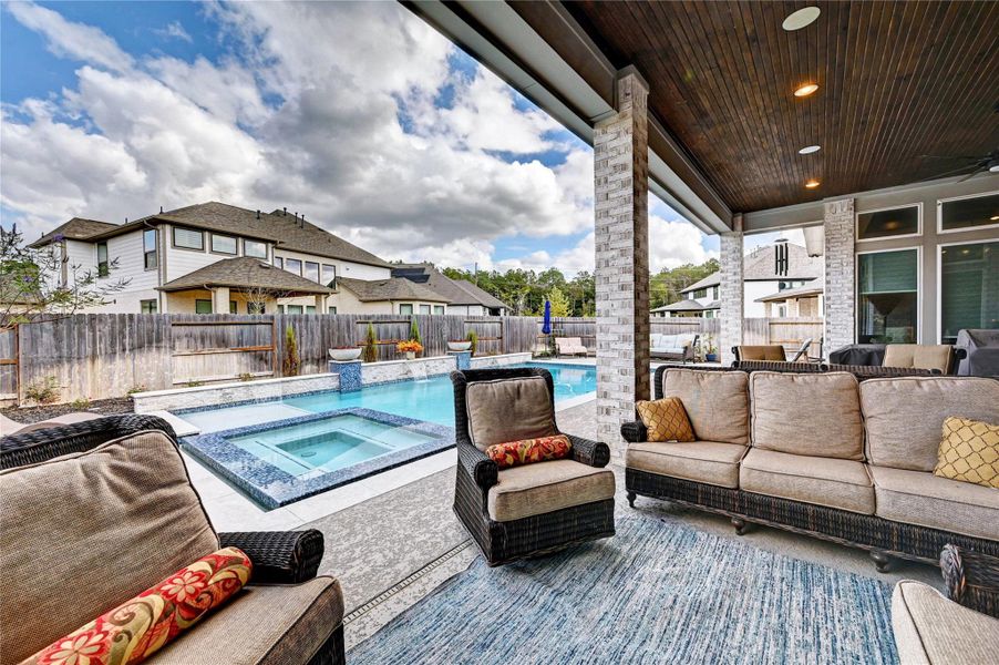 Exterior details and patio area of a home in Artavia 70′, Conroe (Image 3).