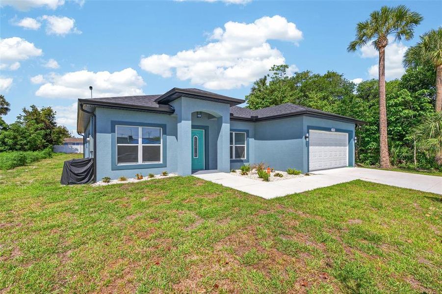 Front exterior of a new home in , Ormond Beach, FL, highlighting curb appeal (Image 27).