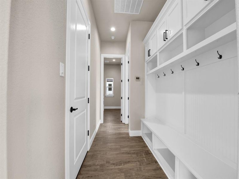 Mudroom featuring dark wood-type flooring