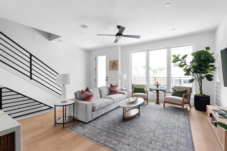 Main living area with high ceilings and abundant light