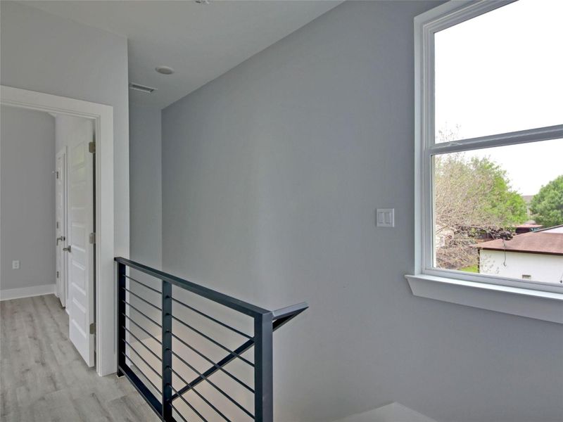 Staircase featuring wood finished floors