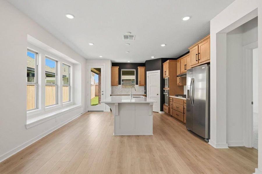 Furnished interior view inside a new home in Bridgeland, Cypress (Image 4).