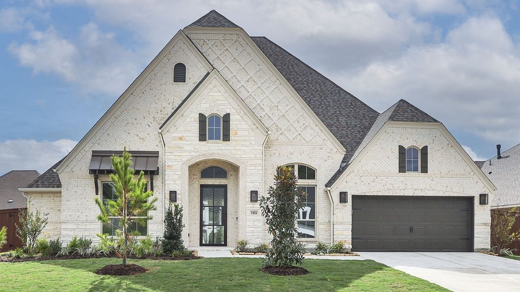 Front exterior of a new home in Evergreen, Conroe, TX, highlighting curb appeal (Image 1). Front exterior of a new home in Evergreen, Conroe, TX, highlighting curb appeal (Image 1).
