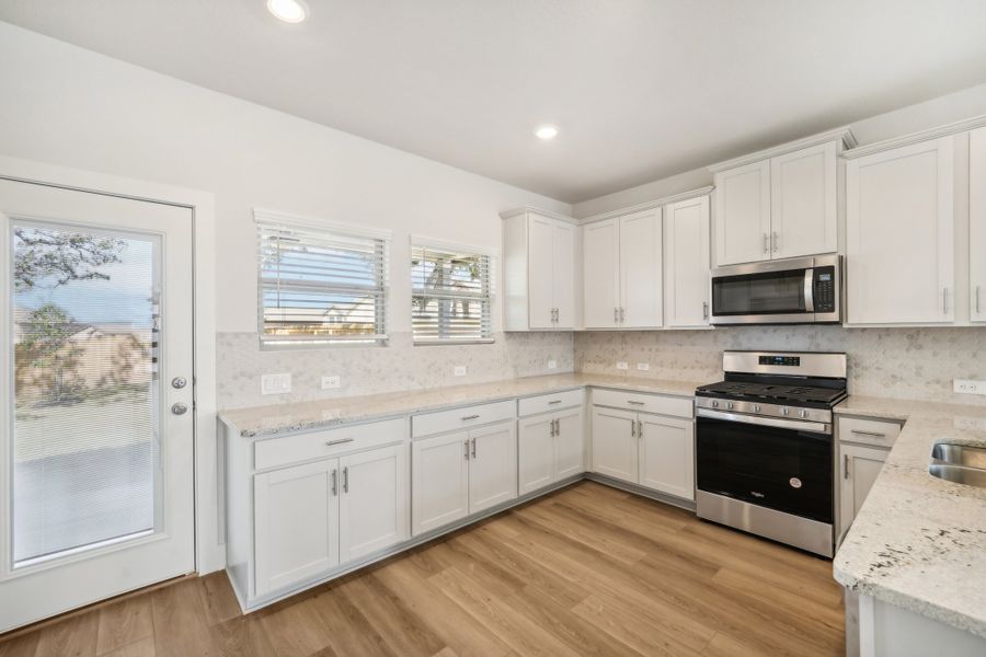 Kitchen in the Medina floorplan at a Meritage Homes community.