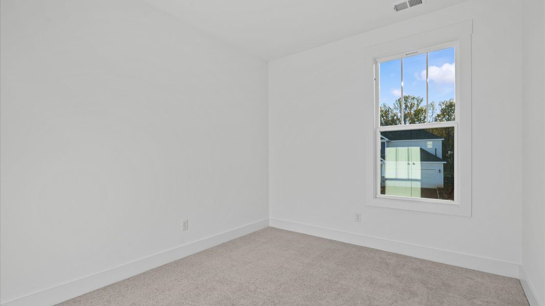 First-class bedroom with generous proportions, a walk-in closet, and beautiful natural light through large windows