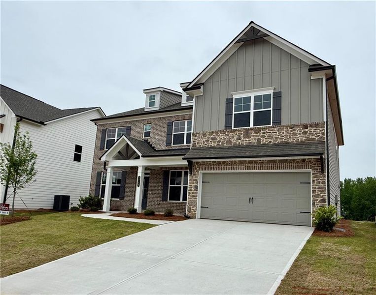Front exterior of a new home in Ponderosa Farms Manor, Gainesville, GA, highlighting curb appeal (Image 28).