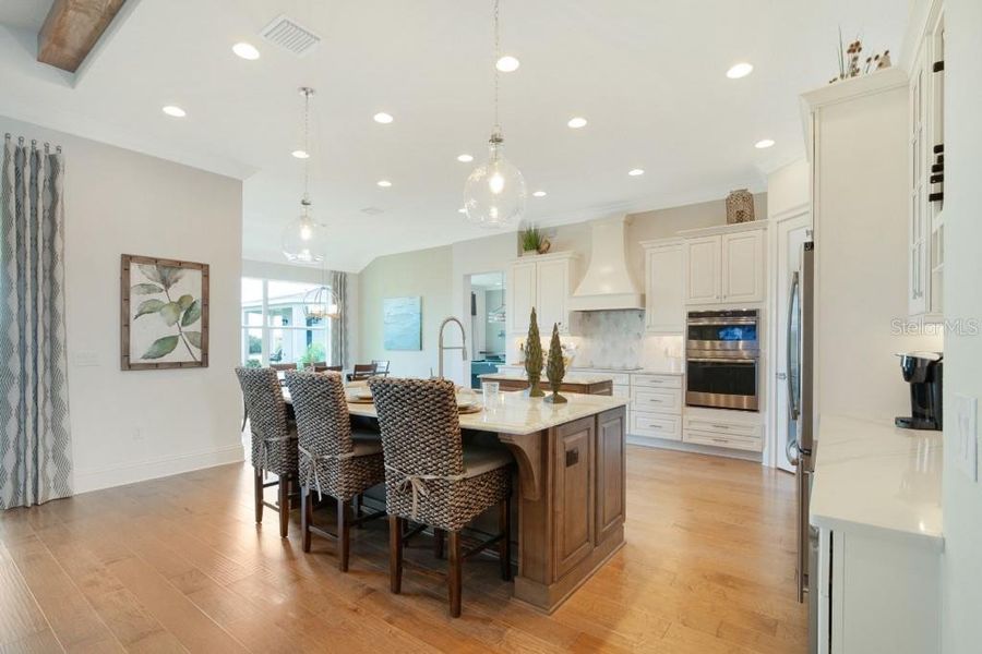 Gourmet Kitchen Big Island, Double Oven, Cooktop and Range Hood (stock photo_