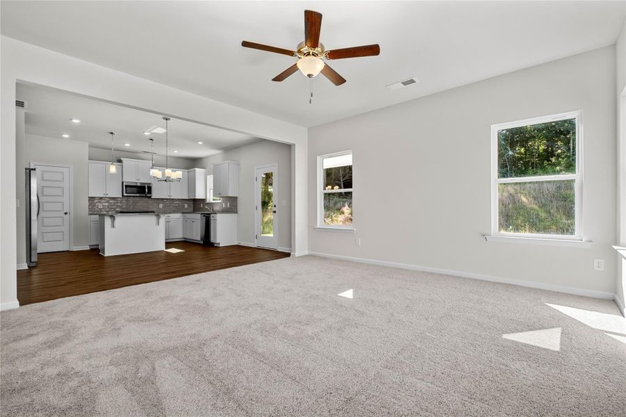 The Coleman- Family Room into kitchen. Home under construction, photo used for illustrative purposes only, colors and options will vary. The Coleman- Family Room into kitchen. Home under construction, photo used for illustrative purposes only, colors and options will vary.