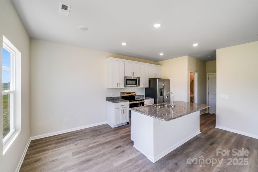 Furnished interior view inside a new home in , Statesville (Image 3).