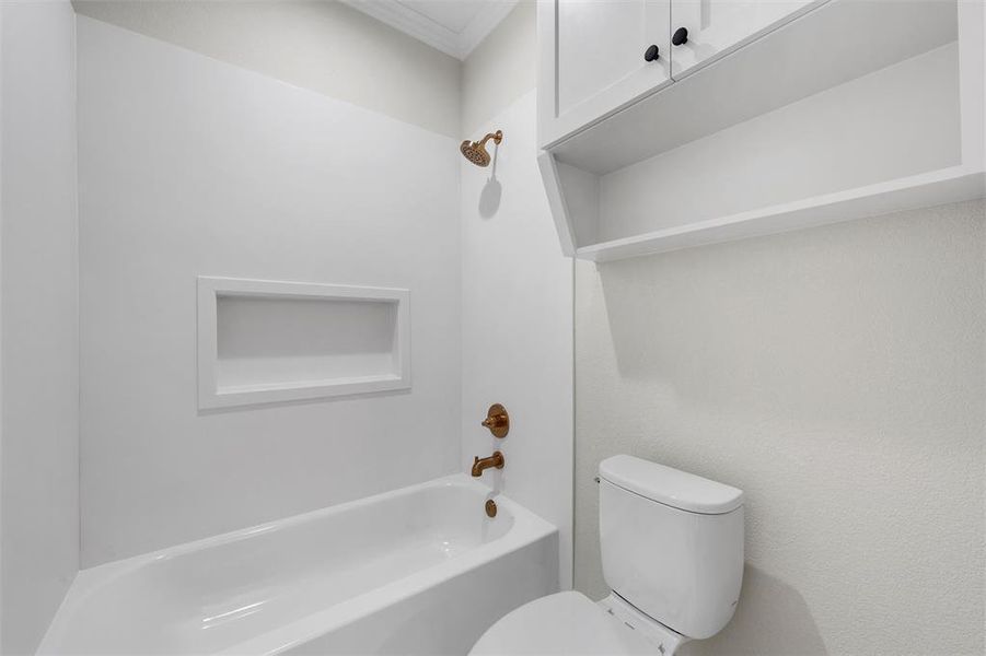 Bathroom with tub / shower combination and crown molding Bathroom with tub / shower combination and crown molding