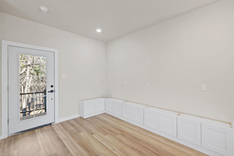 Empty room featuring light wood-type flooring and recessed lighting Empty room featuring light wood-type flooring and recessed lighting