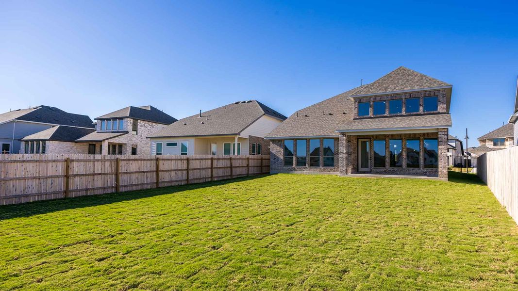 Exterior details and patio area of a home in Santa Rita Ranch 50', Liberty Hill (Image 2).