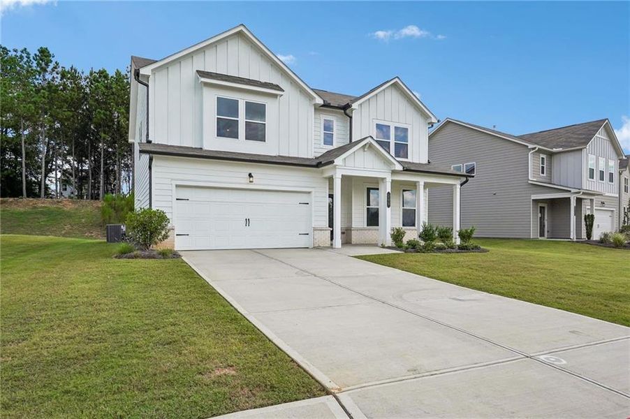 Front exterior of a new home in Heritage River, Euharlee, GA, highlighting curb appeal (Image 1). Front exterior of a new home in Heritage River, Euharlee, GA, highlighting curb appeal (Image 1).