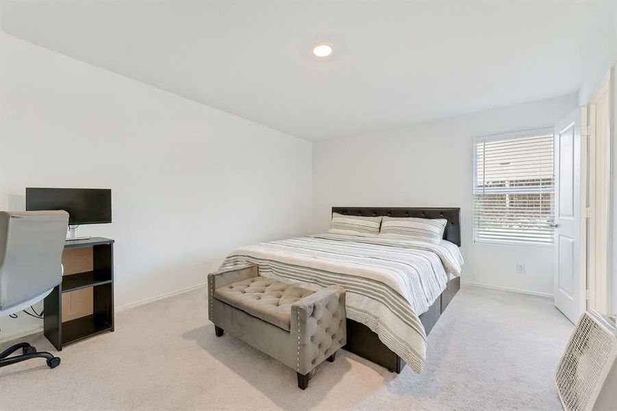 Bedroom featuring light colored carpet, a desk, and recessed lighting Bedroom featuring light colored carpet, a desk, and recessed lighting