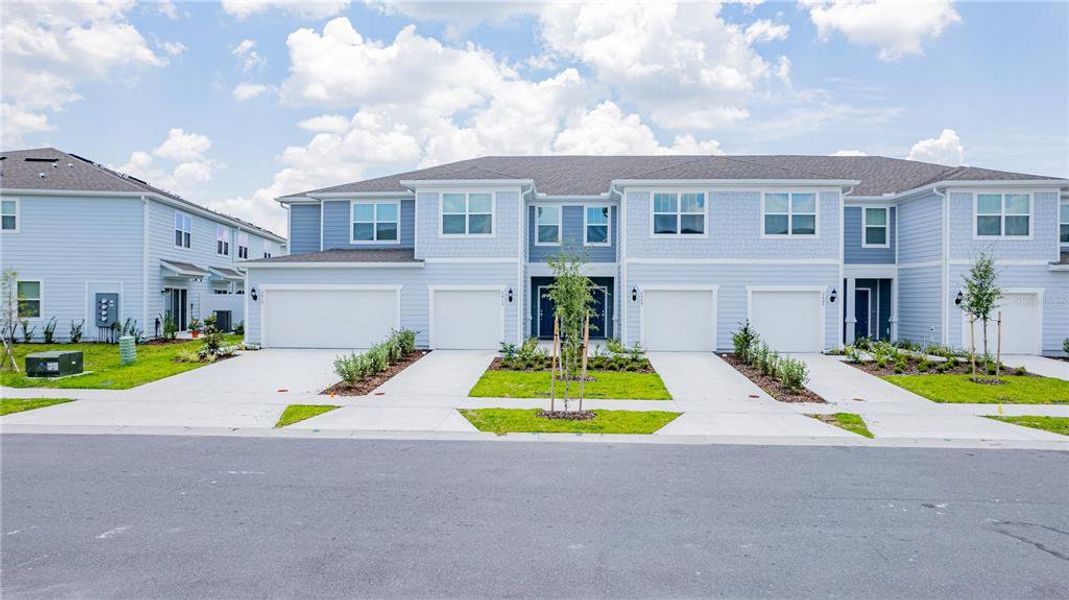 Front exterior of a new home in , Kissimmee, FL, highlighting curb appeal (Image 21). Front exterior of a new home in , Kissimmee, FL, highlighting curb appeal (Image 21).