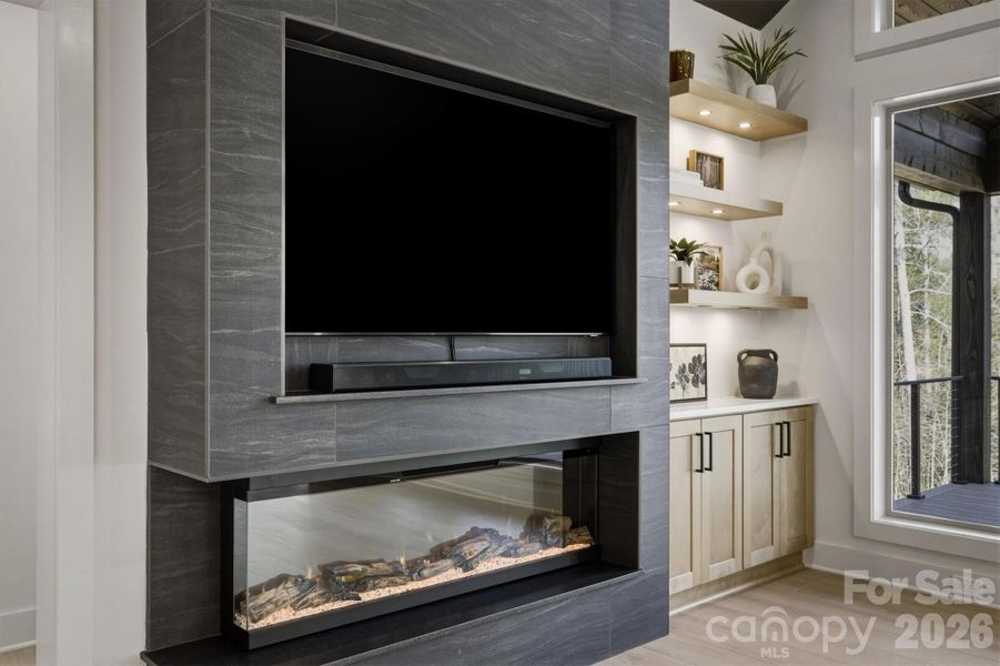 Here is a closer look at the electronics. In the back corner, you will discover the built in cabinetry with lighted floating wood shelves. You will notice that the rooms are all well equipped with convenient storage opportunities and contemporary shelves to showcase your decorative items. Here is a closer look at the electronics. In the back corner, you will discover the built in cabinetry with lighted floating wood shelves. You will notice that the rooms are all well equipped with convenient storage opportunities and contemporary shelves to showcase your decorative items.