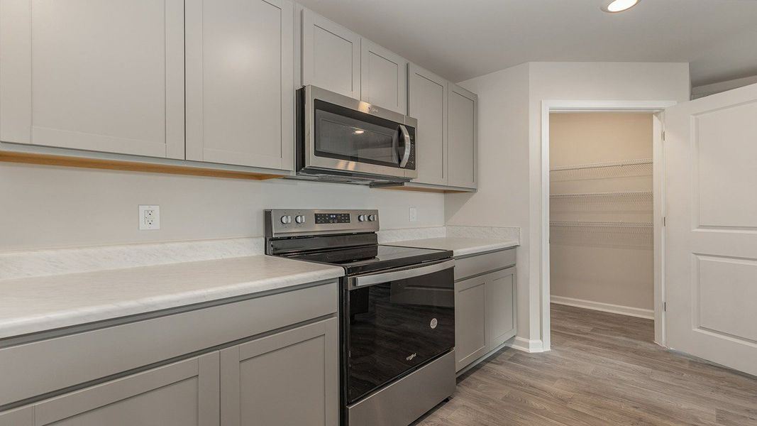 Representative furnished interior of a home built from the DOVER-EXPRESS by D.R. Horton in Stanbury Creek, Supply (Image 7).