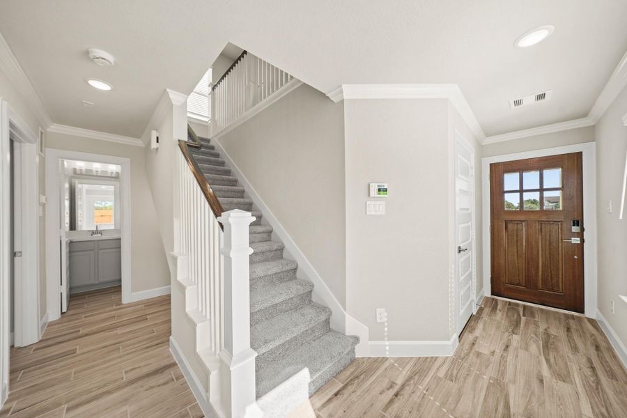 Inviting foyer (*Photo not of actual home and used for illustration purposes only.)Charming dining area (*Photo not of actual home and used for illustration purposes only.)Lovely kitchen (*Photo not of actual home and used for illustration purposes only.)Stylish kitchen (*Photo not of actual home and used for illustration purposes only.)Serene primary suite (*Photo not of actual home and used for illustration purposes only.)Primary bath with dual sinks, tub, and separate shower (*Photo no