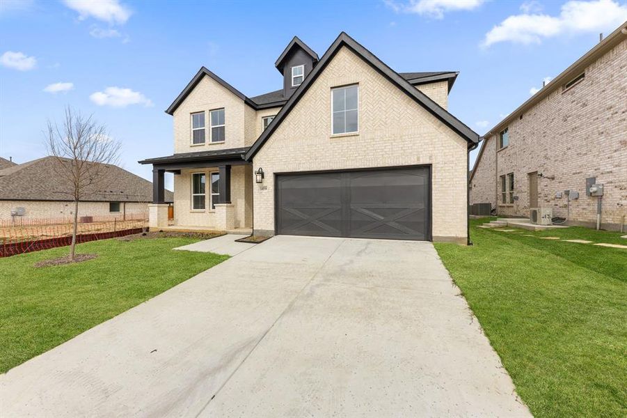 Featuring a beautiful light colored brick with striking dark trim, inviting front porch and eye catching gables, this dream home offers outstanding curb appeal! Featuring a beautiful light colored brick with striking dark trim, inviting front porch and eye catching gables, this dream home offers outstanding curb appeal!