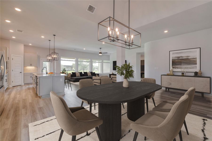Expansive dining area featuring a linear chandelier and wood-finish flooring