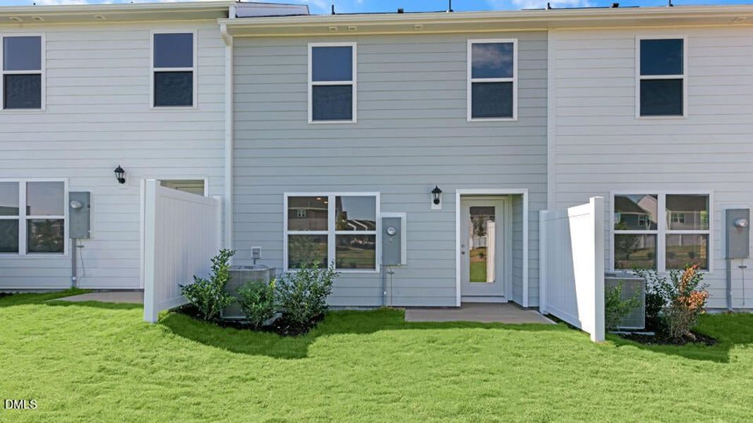 Exterior details and patio area of a home in The Townes at Ridgewood Farms, Winterville (Image 27).