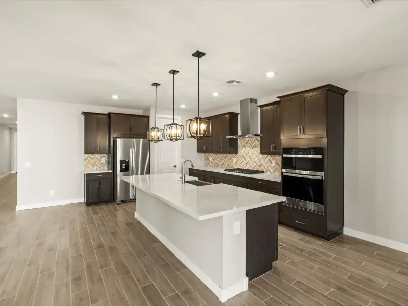 Furnished interior view inside a new home in Entrada Signature Series, Tolleson (Image 6).