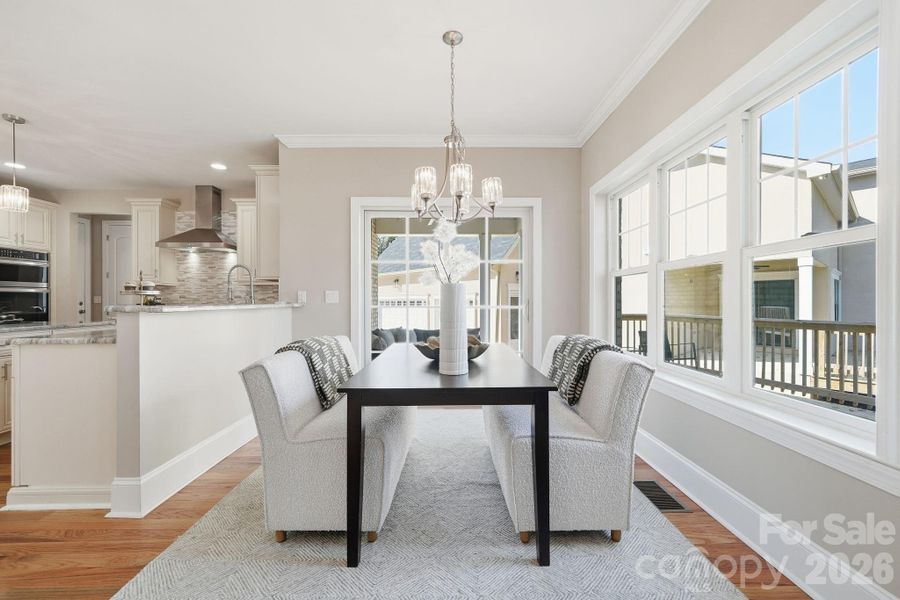 Breakfast nook surrounded by windows — bright, inviting, and perfect for morning coffee. Breakfast nook surrounded by windows — bright, inviting, and perfect for morning coffee.