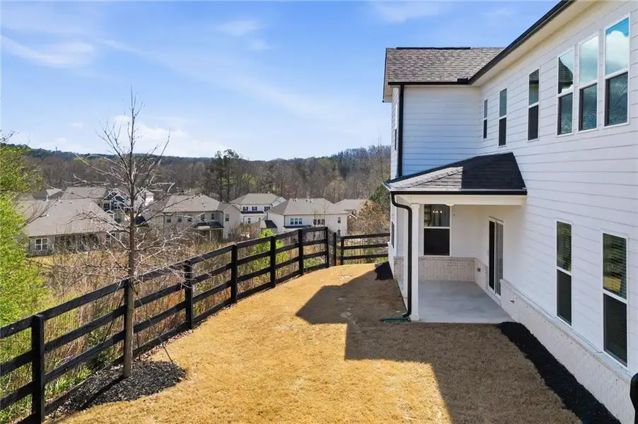 Exterior details and patio area of a home in Carmichael Farms, Canton (Image 4).