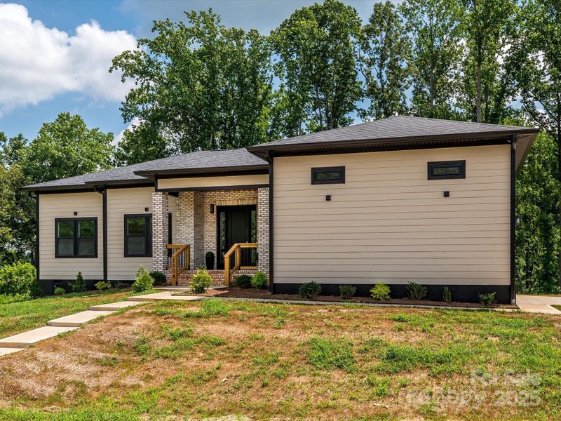 Front exterior of a new home in , Bessemer City, NC, highlighting curb appeal (Image 20). Front exterior of a new home in , Bessemer City, NC, highlighting curb appeal (Image 20).