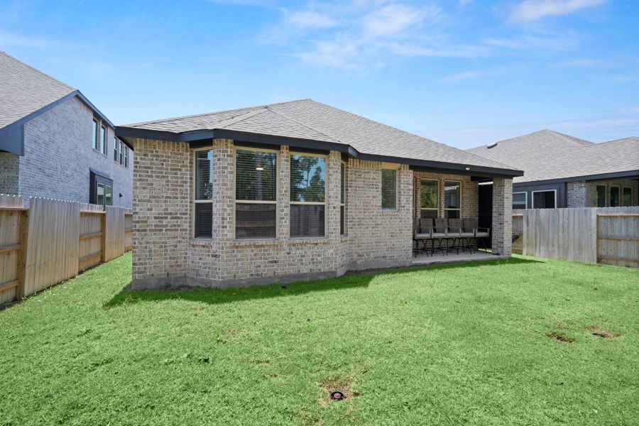 Exterior details and patio area of a home in Evergreen, Conroe (Image 3). Exterior details and patio area of a home in Evergreen, Conroe (Image 3).