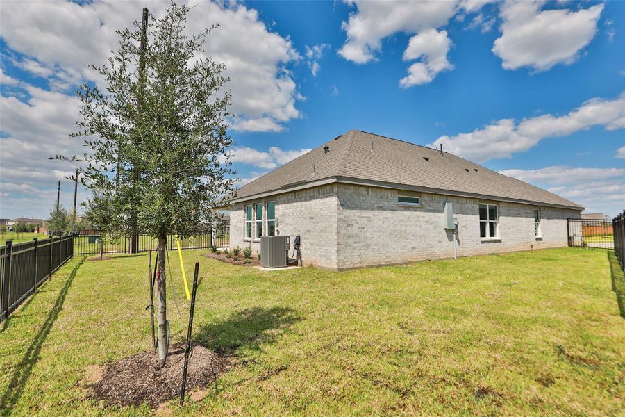 Exterior details and patio area of a home in Sunterra, Katy (Image 1). Exterior details and patio area of a home in Sunterra, Katy (Image 1).