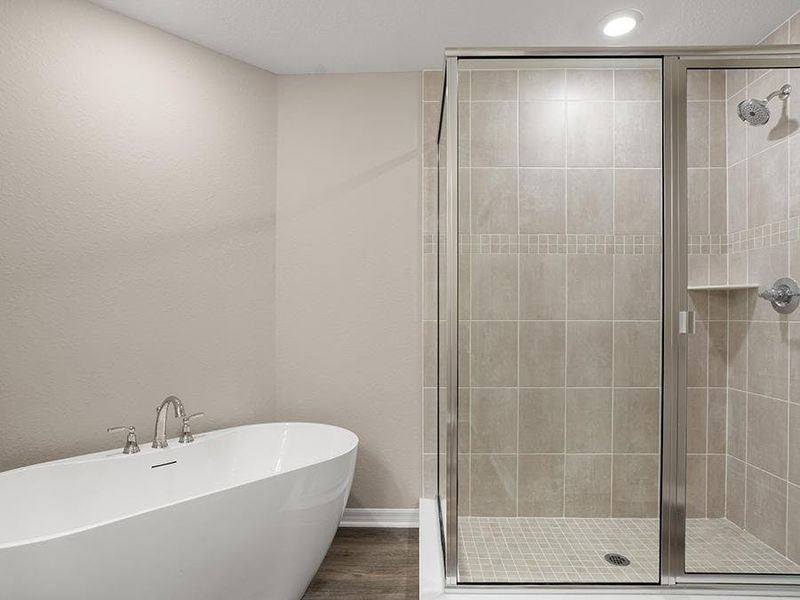 Enjoy the spa-style luxury of a freestanding tub and a large, separate shower - Danyella bungalow by Highland Homes