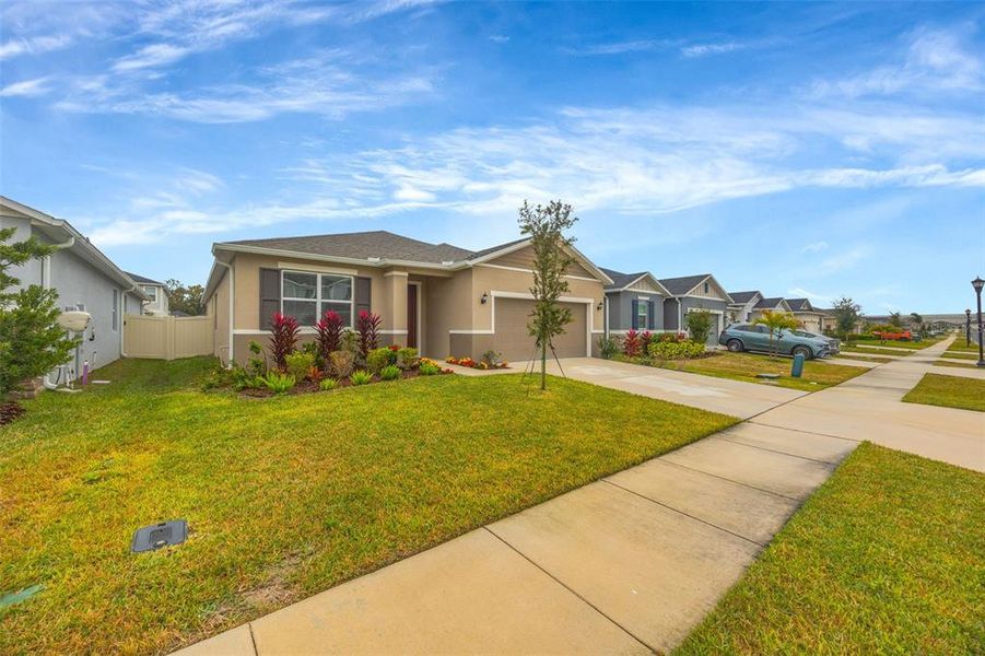 Front exterior of a new home in , Wesley Chapel, FL, highlighting curb appeal (Image 28). Front exterior of a new home in , Wesley Chapel, FL, highlighting curb appeal (Image 28).