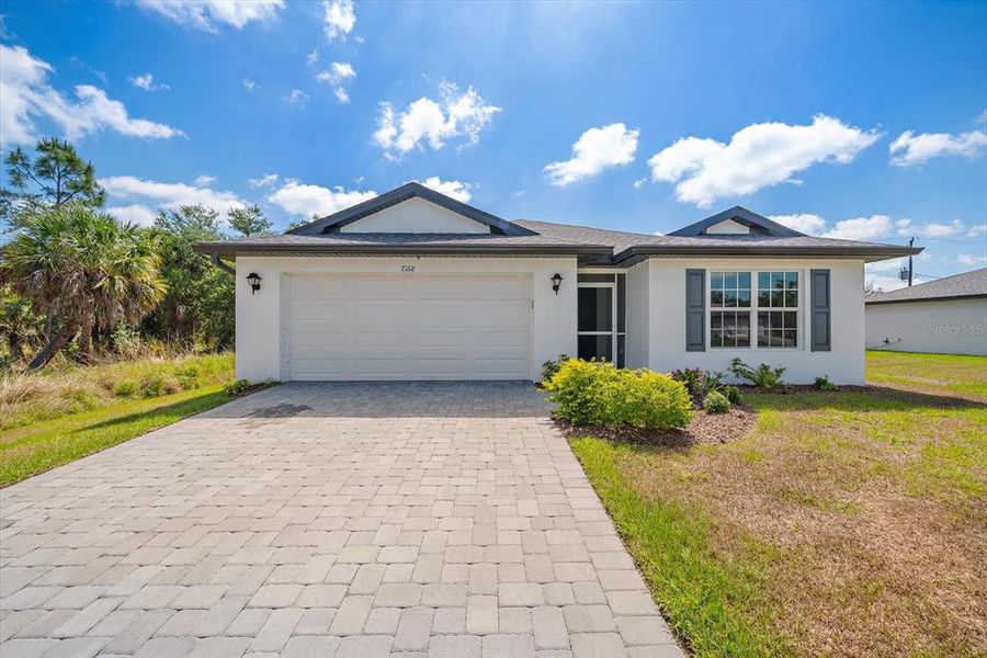 Front exterior of a new home in , Port Charlotte, FL, highlighting curb appeal (Image 23).