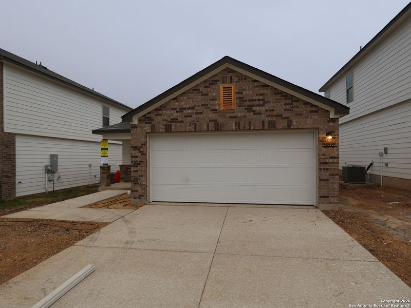 Front exterior of a new home in Paloma Park, Converse, TX, highlighting curb appeal (Image 2).