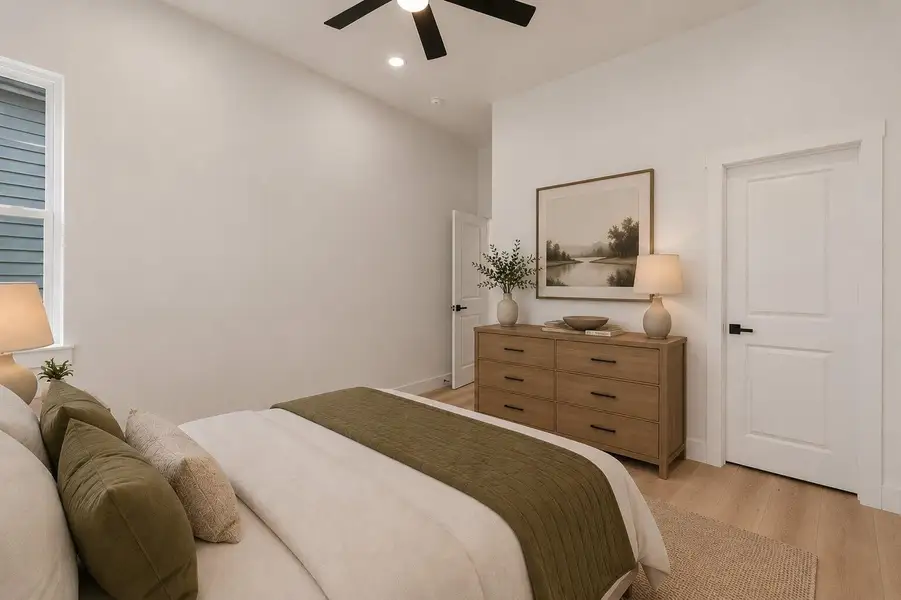 Bedroom offering clean contemporary lines, elevated ceilings and a calm airy ambiance.