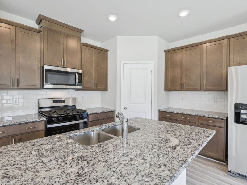 Furnished interior view inside a new home in Northwoods at Mirror Lake, Villa Rica (Image 5).