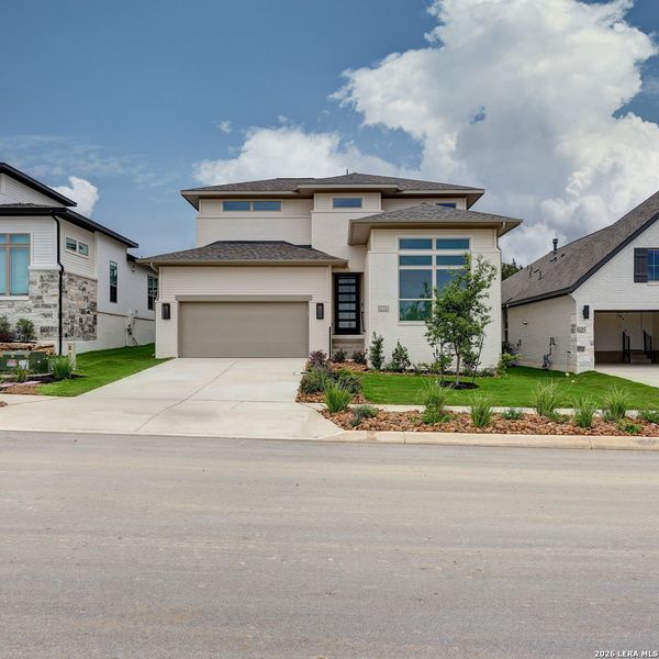 Front exterior of a new home in Esperanza, Boerne, TX, highlighting curb appeal (Image 2). Front exterior of a new home in Esperanza, Boerne, TX, highlighting curb appeal (Image 2).