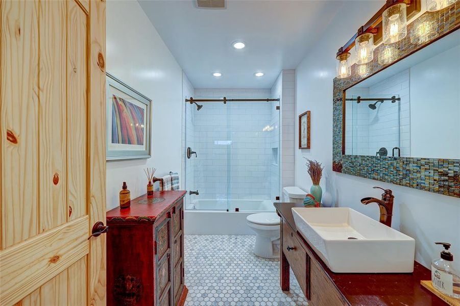 High end finishes throughout this home. Note the barndoor style bypass glass enclosure for this tub/shower combo. 94 San Saba St Austin TX 78702 MLS# 7207900