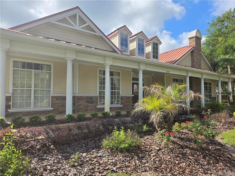 Front exterior of a new home in Wyld Palms, Inverness, FL, highlighting curb appeal (Image 1).