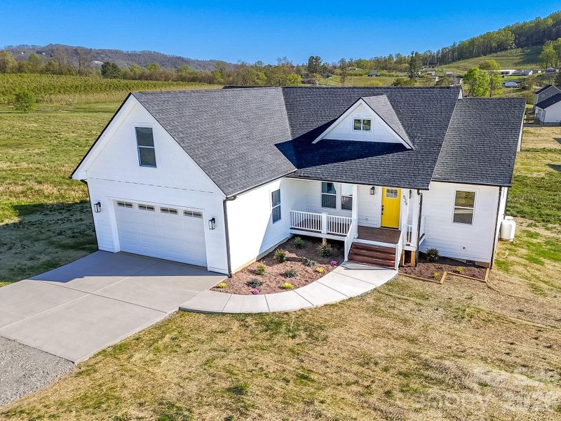 Front exterior of a new home in , Hendersonville, NC, highlighting curb appeal (Image 1). Front exterior of a new home in , Hendersonville, NC, highlighting curb appeal (Image 1).