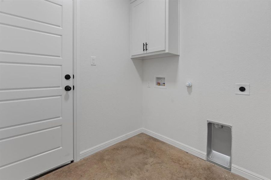 Washroom with hookup for a washing machine, cabinets, gas dryer hookup, and hookup for an electric dryer