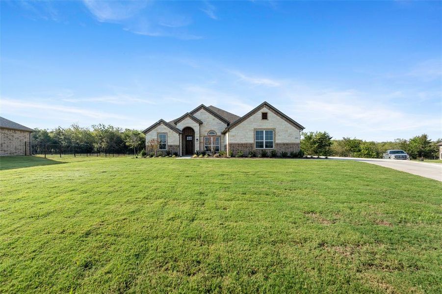 Front exterior of a new home in Vista Oaks Estates, Royse City, TX, highlighting curb appeal (Image 20).