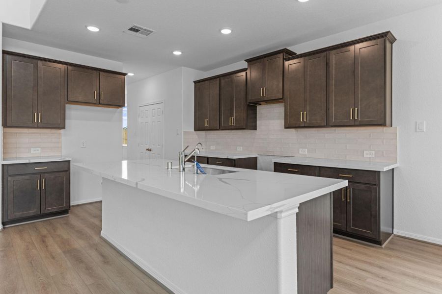 This kitchen is not only a functional space but also has ample storage. Whether you're a seasoned chef or just love to gather and enjoy good food, this kitchen is a dream come true. This kitchen is not only a functional space but also has ample storage. Whether you're a seasoned chef or just love to gather and enjoy good food, this kitchen is a dream come true.